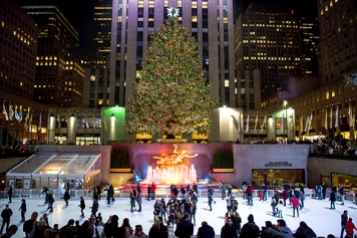 F91373 NEW YORK CITY, USA - DECEMBER 10, 2015: Ice skaters fill the skating rink under the Rockefeller Center Christmas tree.
